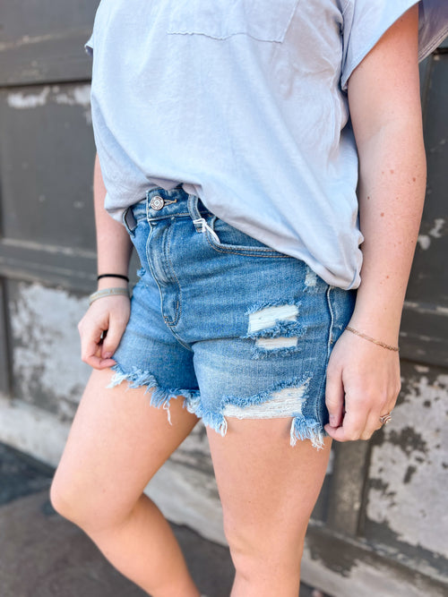 super high rise shorts with frayed edges and distressing