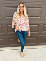 Hayden floral peplum blouse with v-neck and tiered waistband in cream, red, and gray