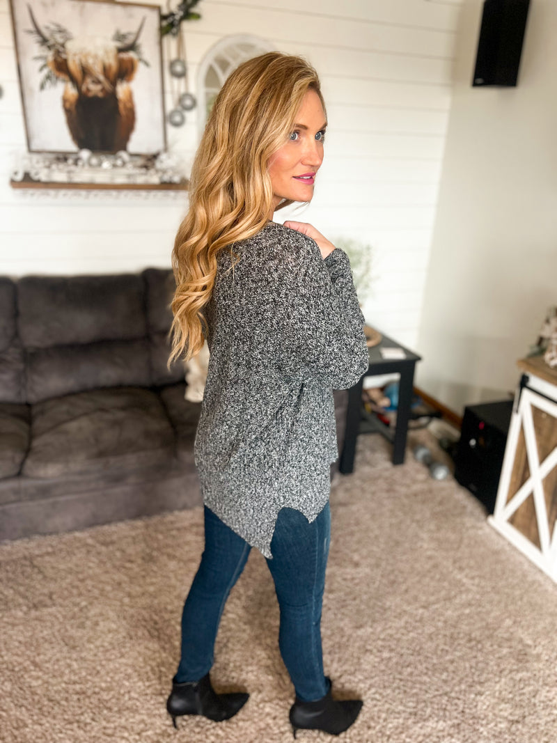la miel v-neck sweater with drop shoulder, loose body, and tight arms in black snow