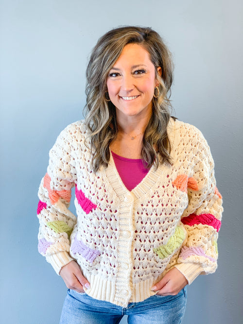Collective Rack multi-color button up cardigan in cream, pink, coral, citron, and lilac
