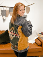 distressed black denim jacket with camel suede accents and aztec patchwork