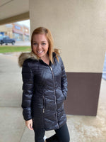 black faux leather fur-lined quilted long coat with zippers
