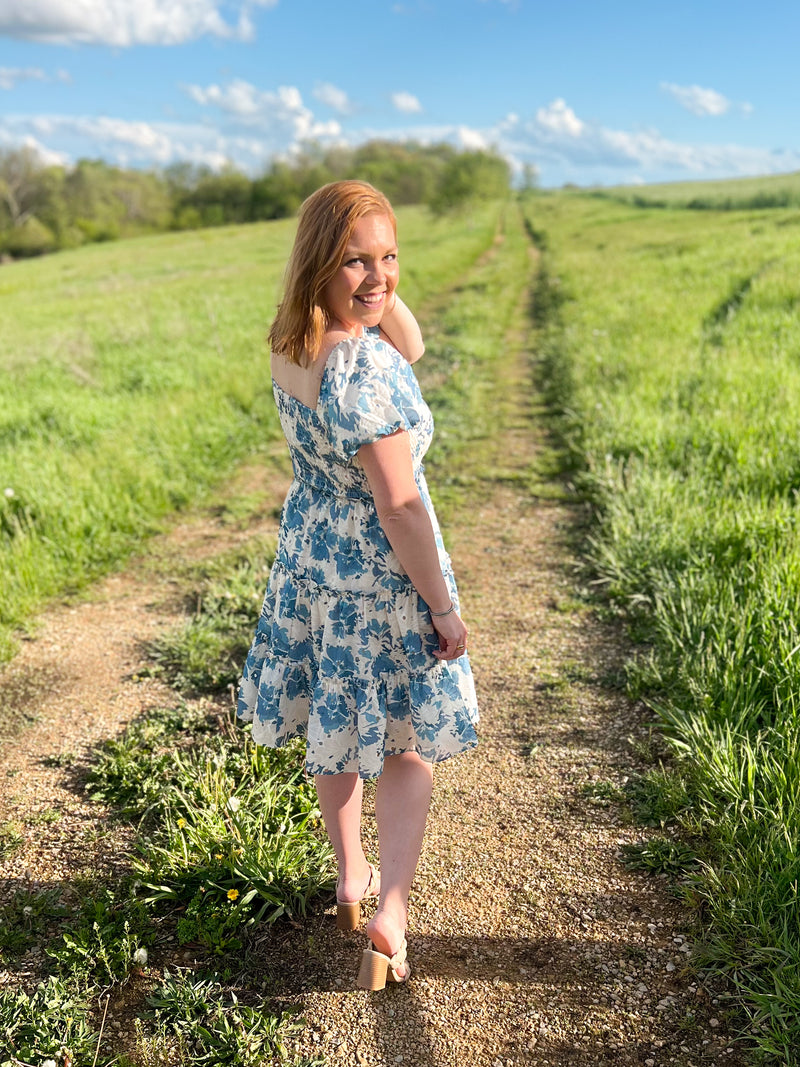 blue and cream floral mini dress with puff sleeves