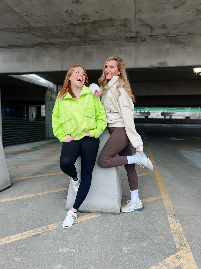 AEMI & CO quarter zip with oversized front pockets in cream and lime