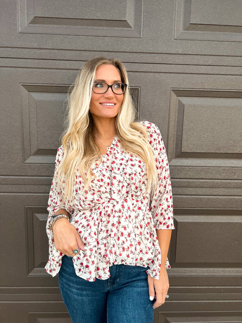 Hayden floral peplum blouse with v-neck and tiered waistband in cream, red, and gray