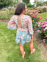 teal and pink mixed floral pattern romper with deep plunge