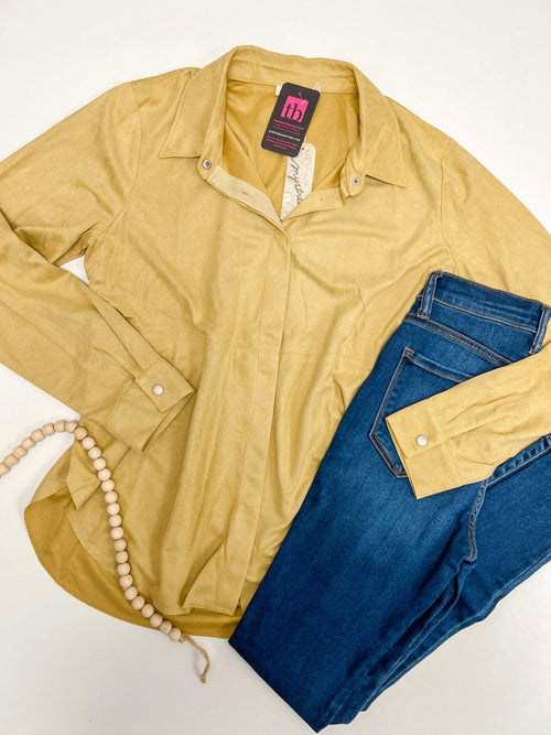 Mustard suede button down shirt with hidden buttons, paired with dark denim jeans