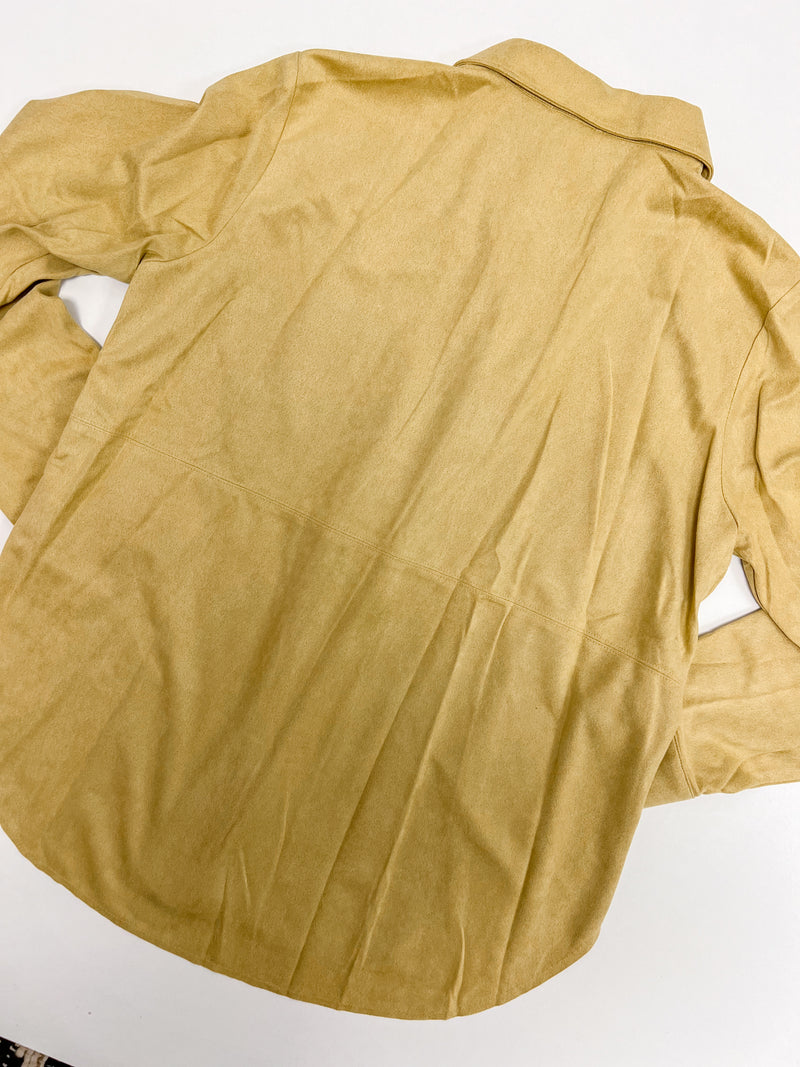Back of mustard suede button down shirt with hidden buttons