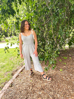 smocked linen jumpsuit with ribbon tie straps in light blue