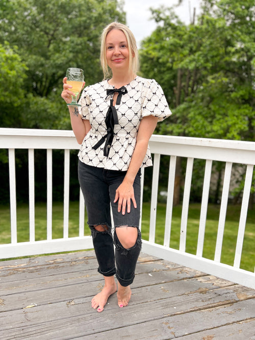 Penelope Bow Peplum Top