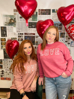 Hrt & Luv crewneck mineral wash sweatshirt with LOVE printed on chest in peach and red