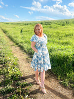 blue and cream floral mini dress with puff sleeves