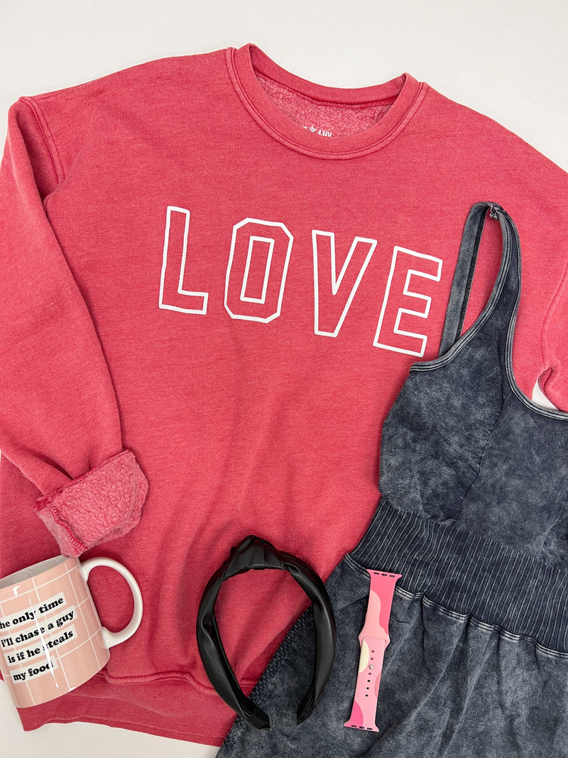 Hrt & Luv crewneck mineral wash sweatshirt with LOVE printed on chest in red