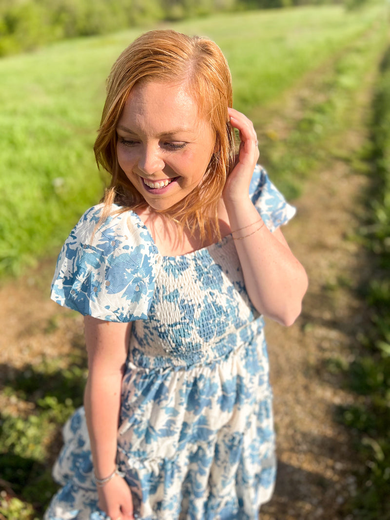 blue and cream floral mini dress with puff sleeves