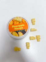 Happy Wax Eco Tin Pineapple Mango close up of bear-shaped wax melts