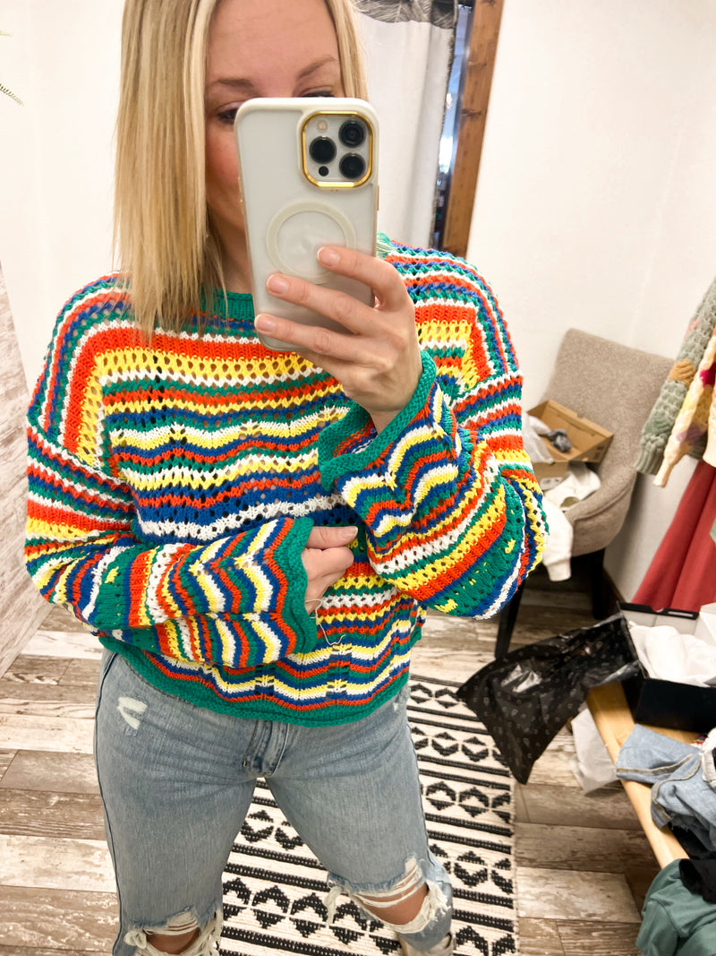 Collective Rack pointelle knit sweater with striped design in green, yellow, orange, blue, and white
