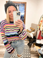 Collective Rack pointelle knit sweater with striped design in black, blue, yellow, pink, and white