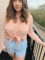 Love Tree orange and white striped button down long sleeve top with two front pockets