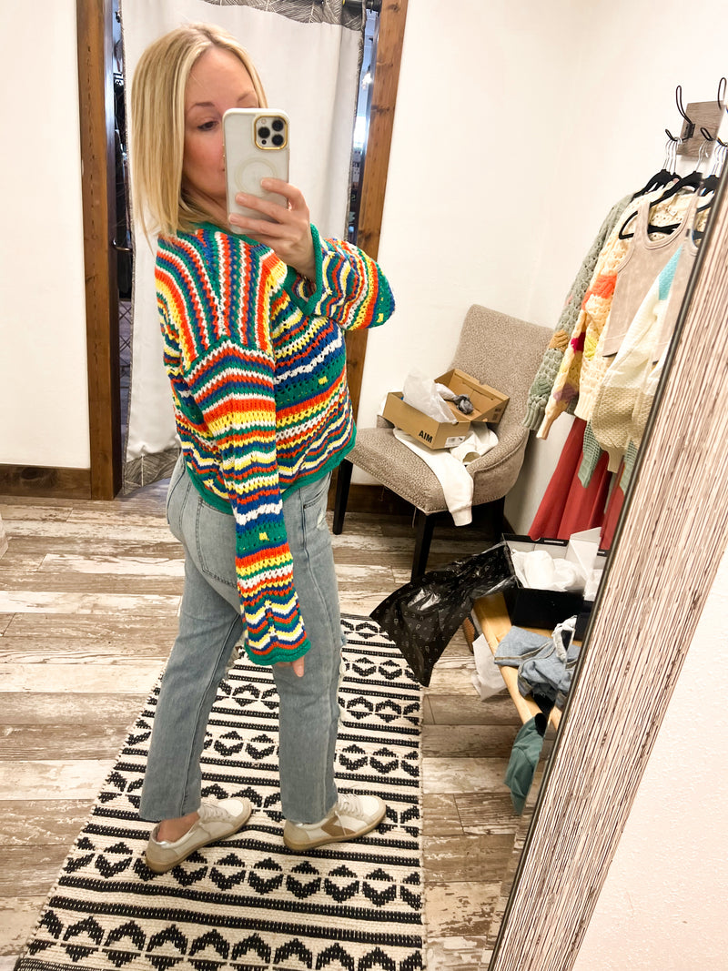 Collective Rack pointelle knit sweater with striped design in green, yellow, orange, blue, and white