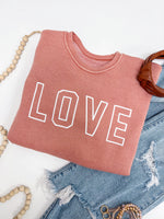 Hrt & Luv crewneck mineral wash sweatshirt with LOVE printed on chest in peach