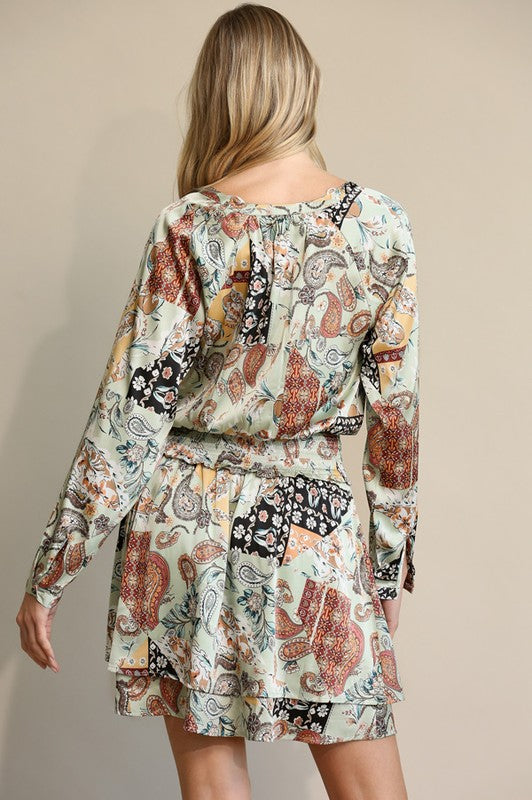 satin paisley pattern long sleeve mini dress in teal, cream, rust, and black