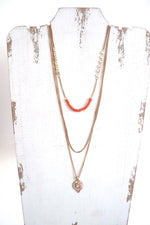gold triple layered necklace with pendant and orange beads