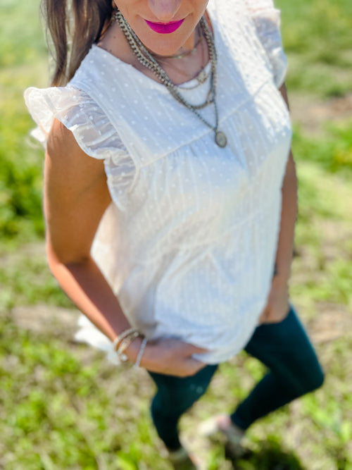 cream swiss dot ruffled tiered top sleeveless blouse