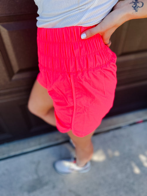 Neon Coral Pink Smocked Windbreaker running shorts