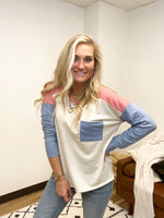lightweight, relaxed fit long sleeve top with navy and coral sleeves 