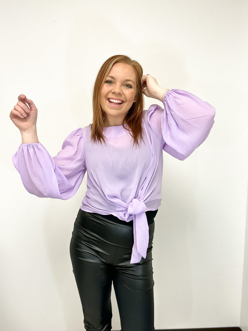 avender sheer blouse with balloon sleeves and a front tie 