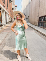 Form Fitted Satin Midi Dress with Elastic Straps and open back, color shown in sage.