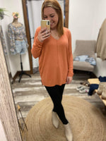 Orange high-low tunic sweater