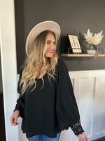 Black  V-neck blouse with bishop sleeves and wrist lace trim